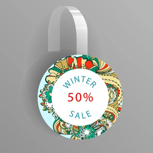 Round decorative tag with 'Winter 50% Sale' text on a gray background
